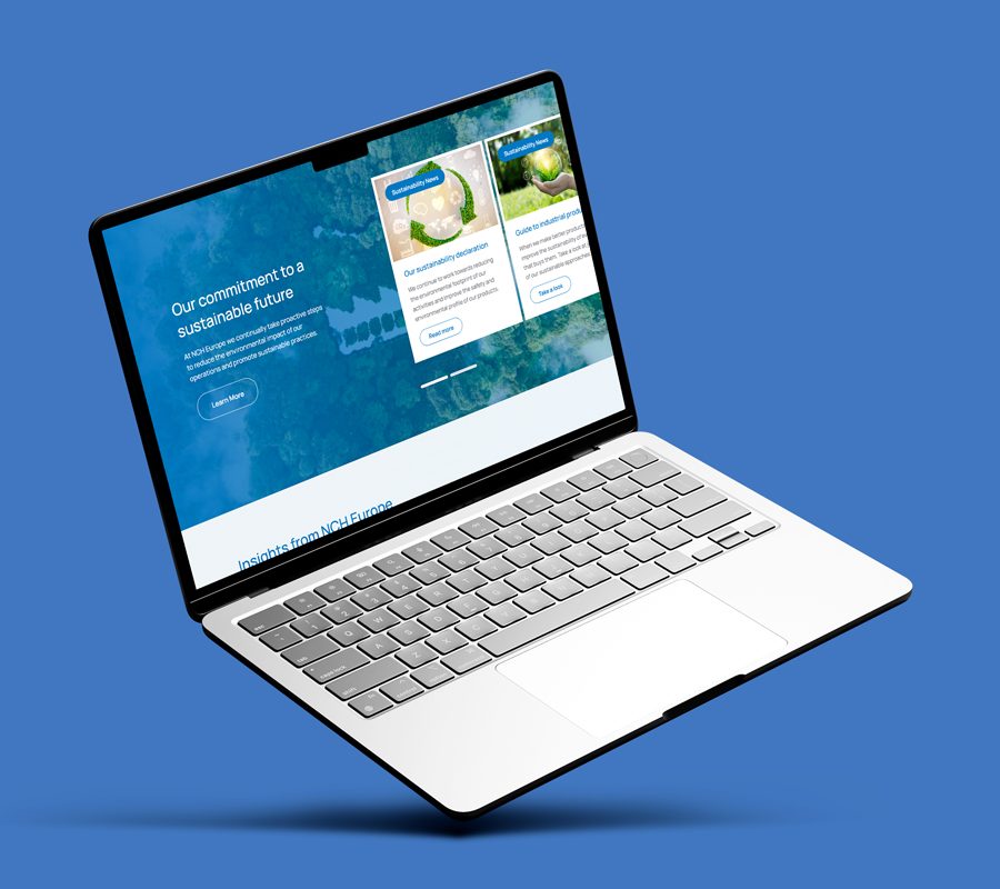 Open laptop on a blue background displaying NCH Europe website