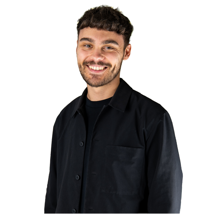 Smiling headshot of Social Media Specialist Luke.