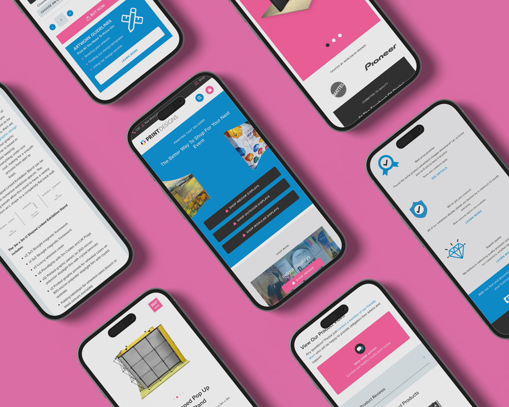 Multiple mobile phones on a pink background, displaying various webpages from the Print Designs website.